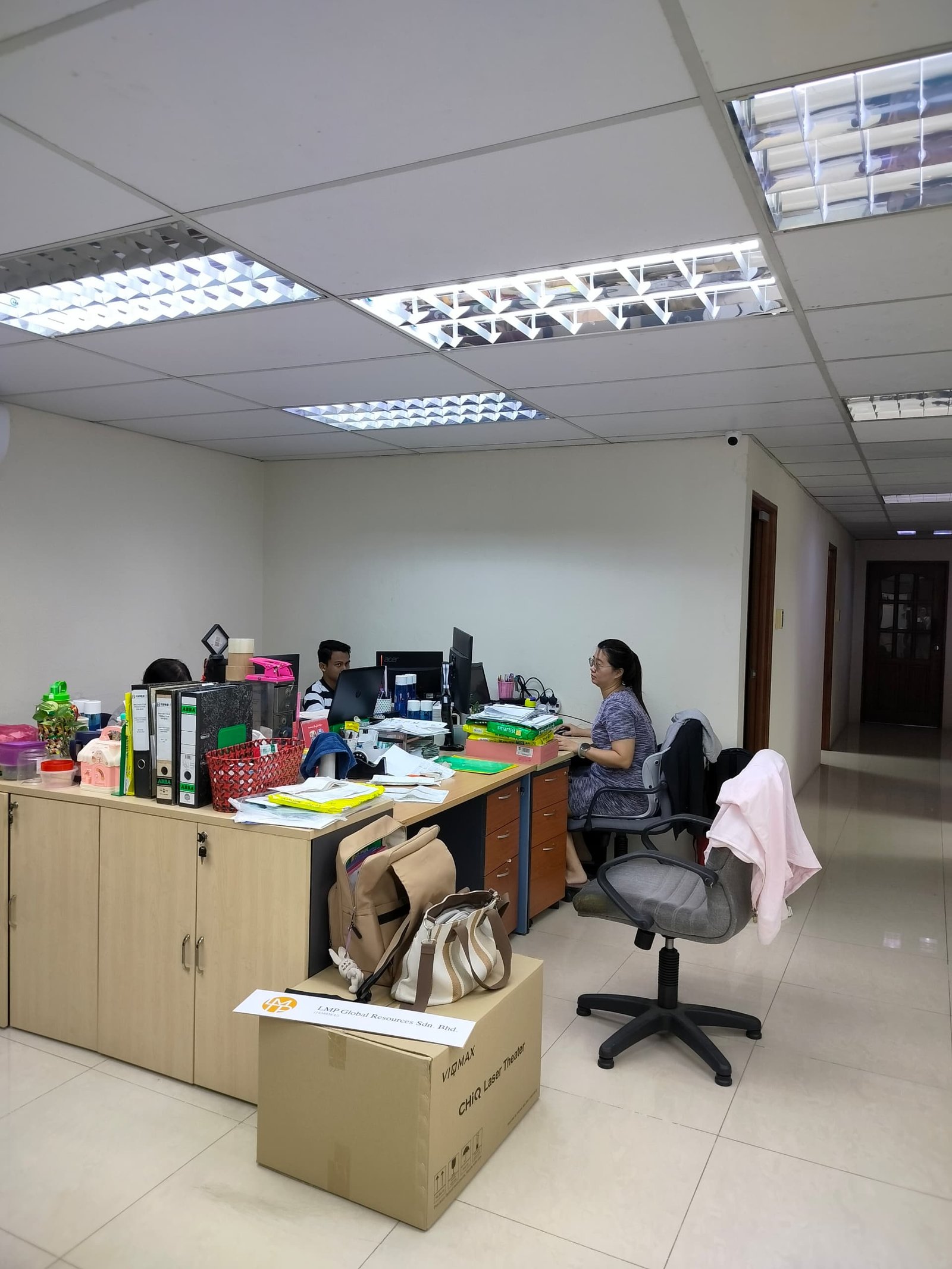 CNE Holdings team working together in modern office environment